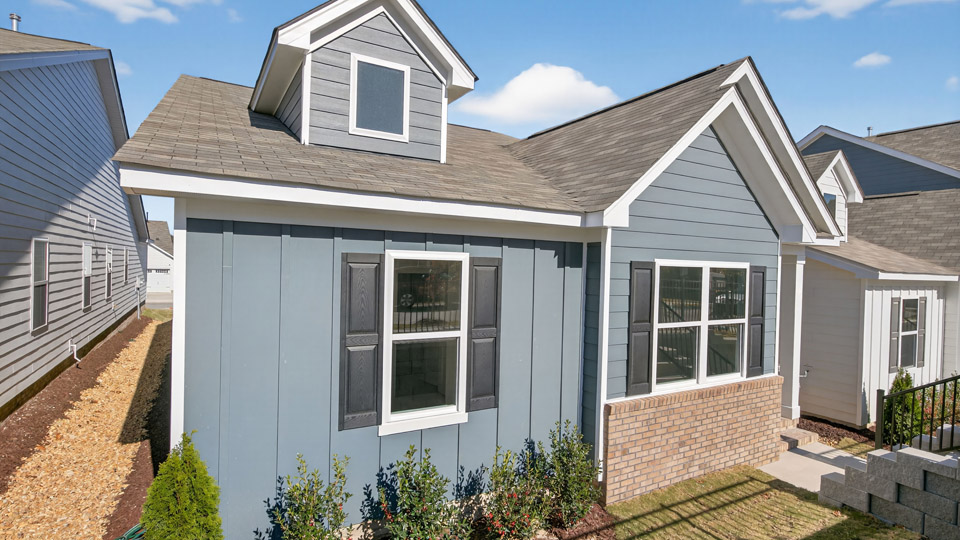 Single story home with blue siding
