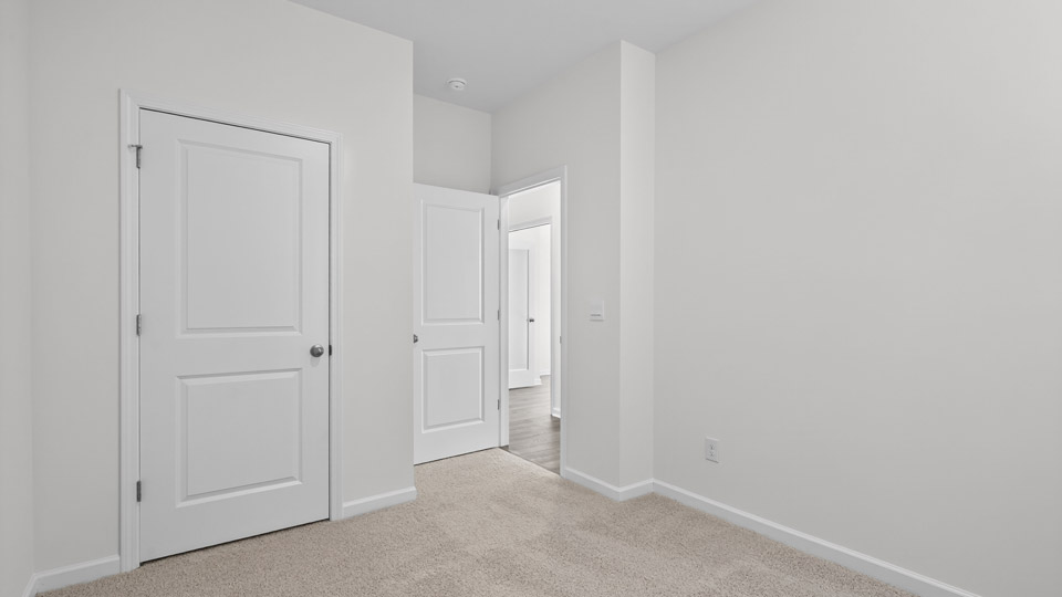 Bedroom with carpet floor and closet