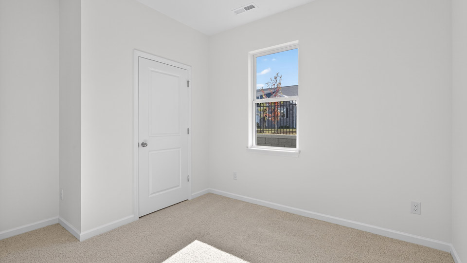 Bedroom with carpet floor and closet