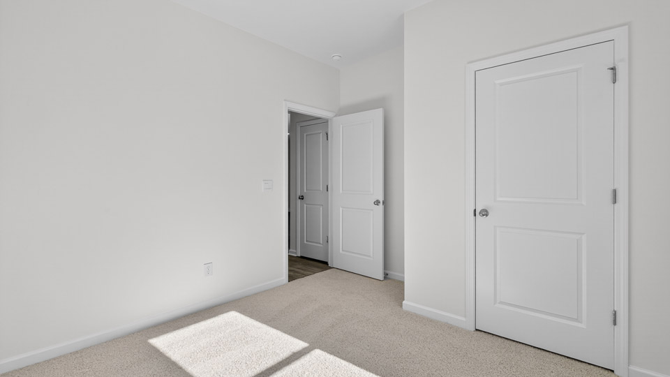Bedroom with carpet floor and closet