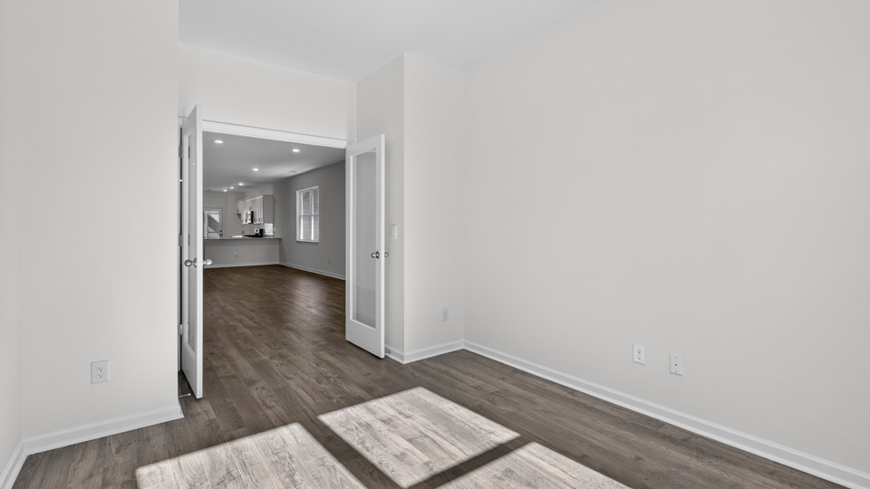Study room with hardwood floors and big windows