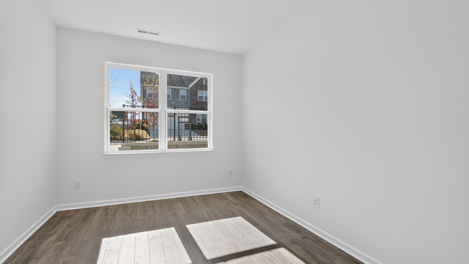 Study room with hardwood floors and big windows