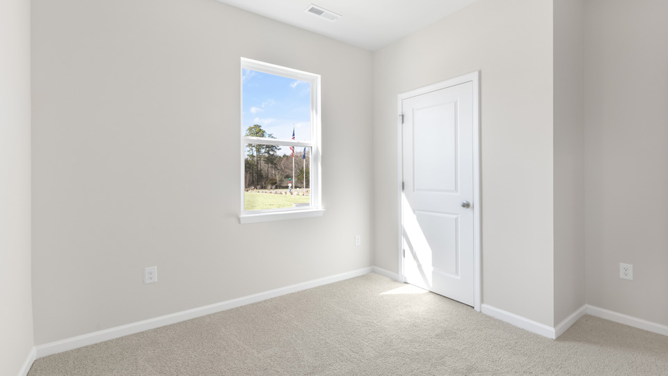additional bedroom with window, carpeting, closet