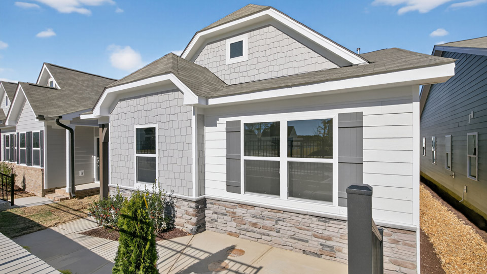 Single story home with white siding