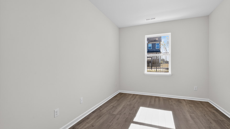 Study room with hardwood floors and big windows