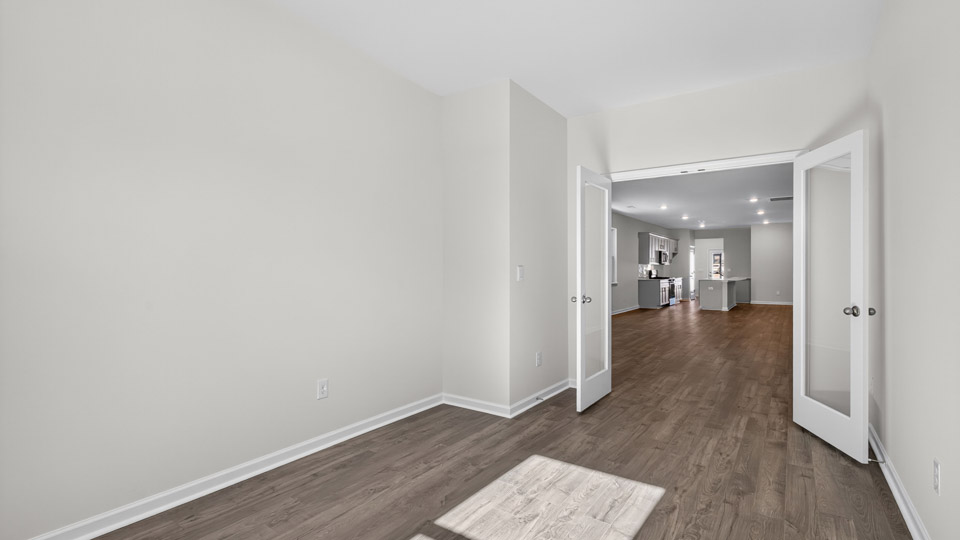 Study room with hardwood floors and big windows
