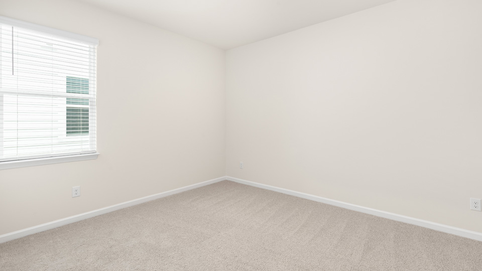 Bedroom with carpet flooring