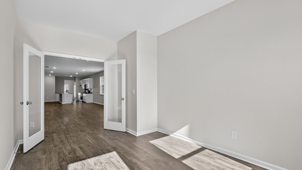Study room with hardwood floors and big windows