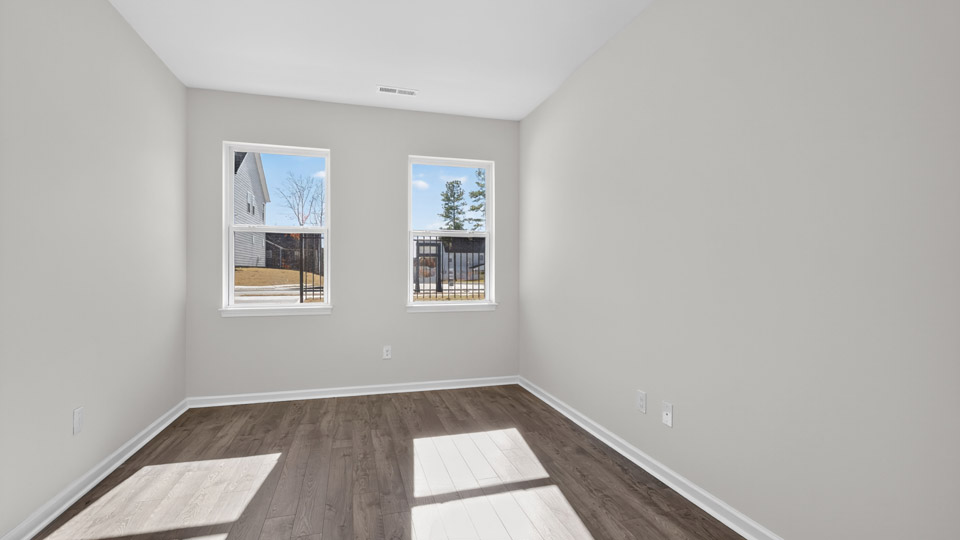 Study room with hardwood floors and big windows