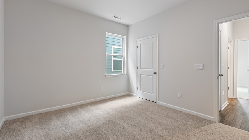 Bedroom with carpet flooring