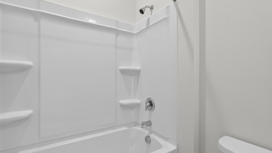 bathroom with tub shower combo