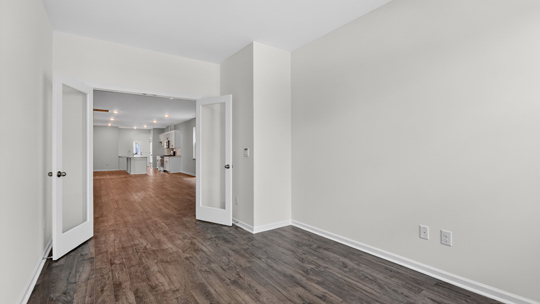 study with glass french doors and revwood flooring