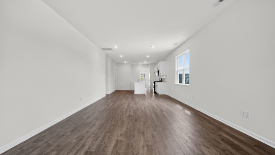 open concept living space with large windows