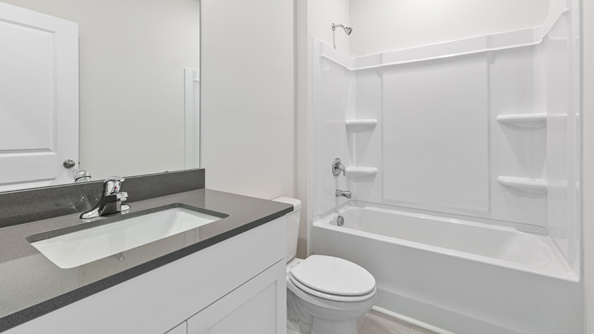 Bathroom with white cabinets