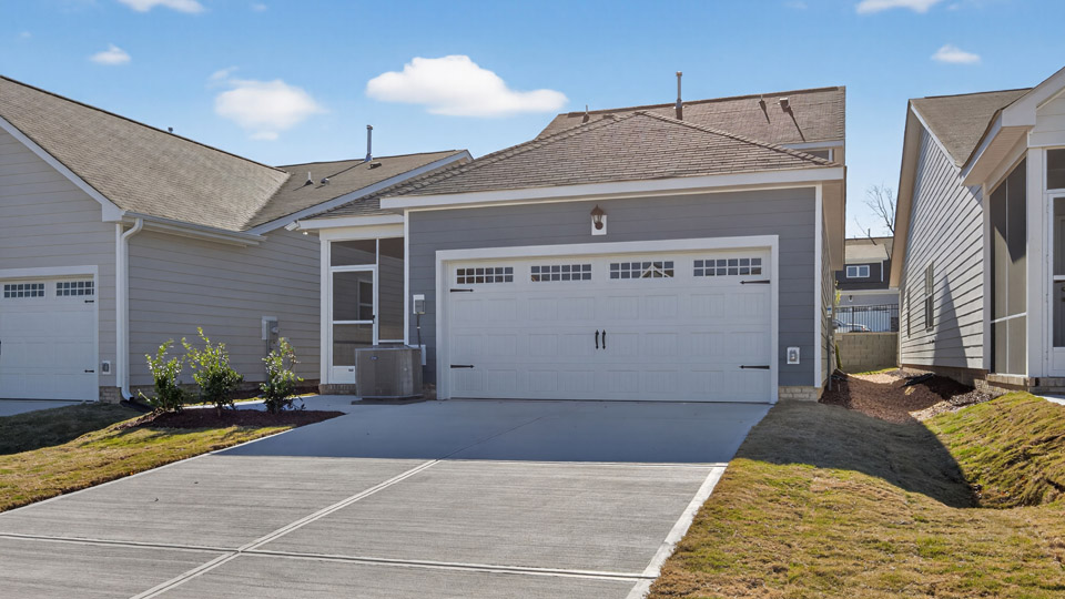 Two story home with blue colored siding and garage