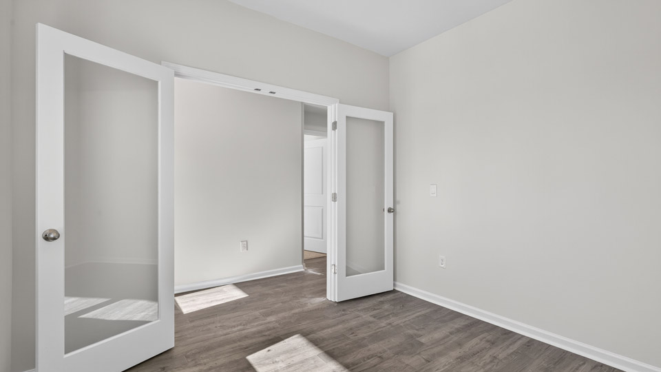 Study room with hardwood floors and big windows