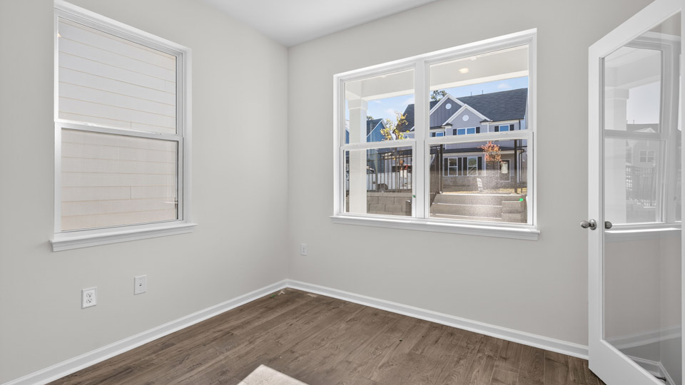Study room with hardwood floors and big windows