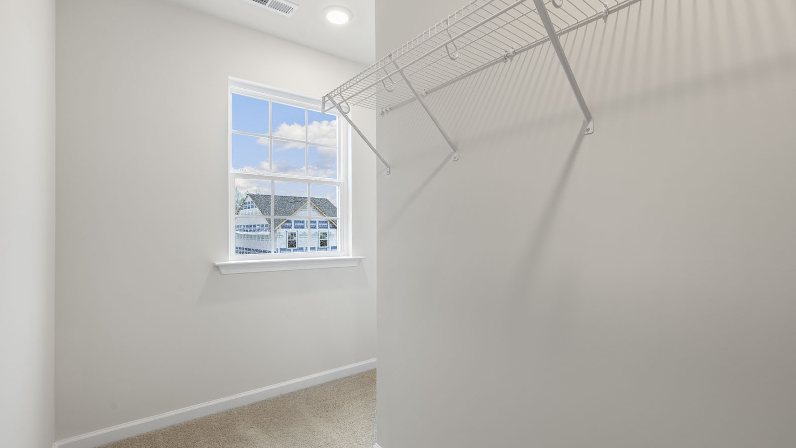 PRIMARY SUITE WALK-IN CLOSET