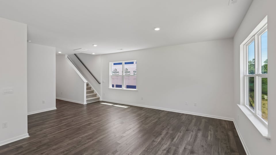 open concept living space with large windows