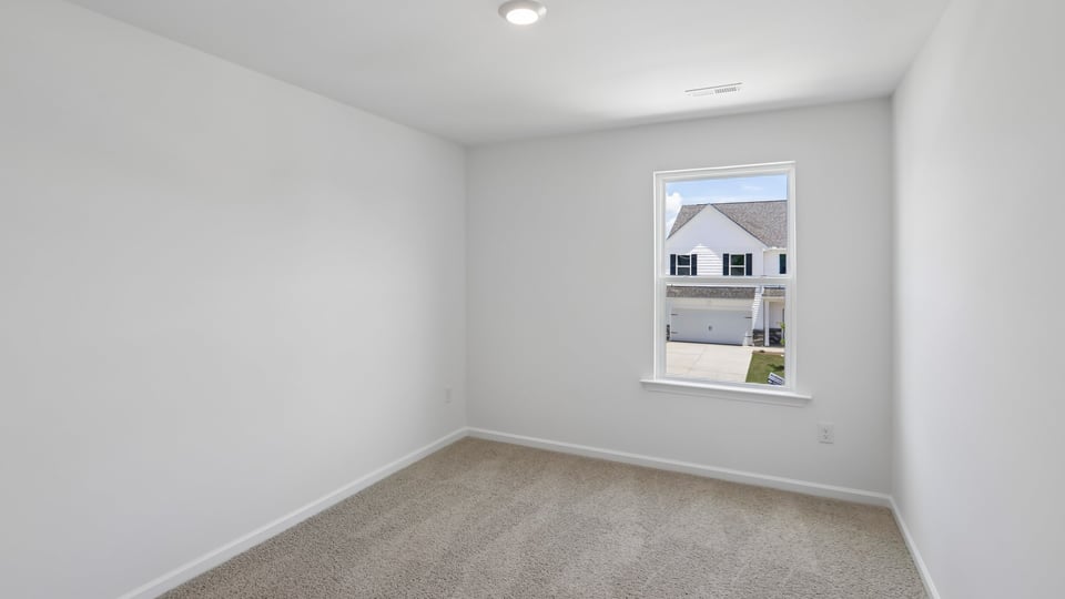 additional bedroom with window, carpeting, closet