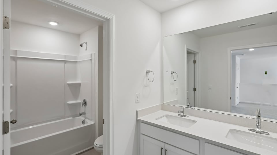 additional bathroom with double vanity sink