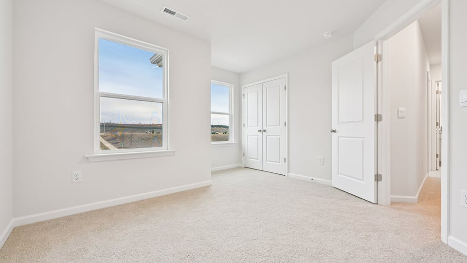upstairs loft with carpet flooring