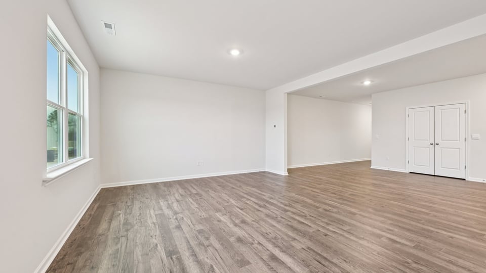 open concept living space with large windows