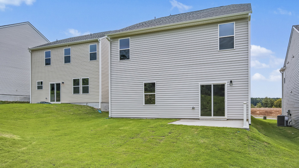 back of robie with concrete patio