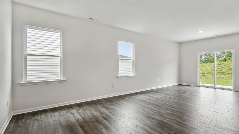 open concept living room with glass doors to patio