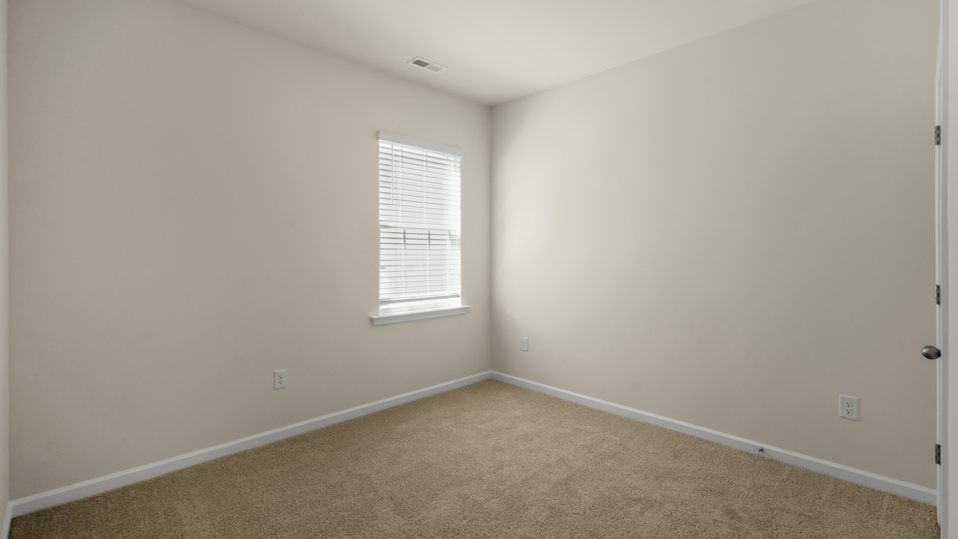 additional bedroom with window, carpeting, closet
