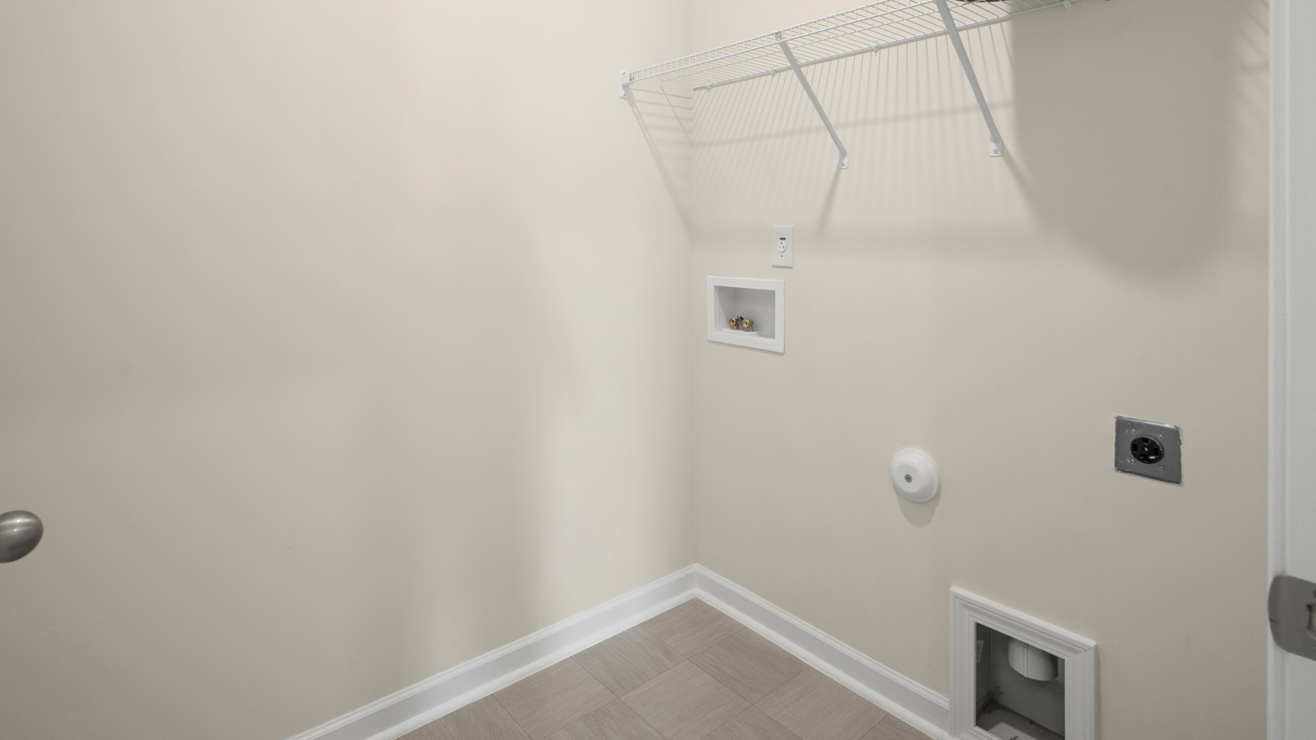 laundry room with wire shelving