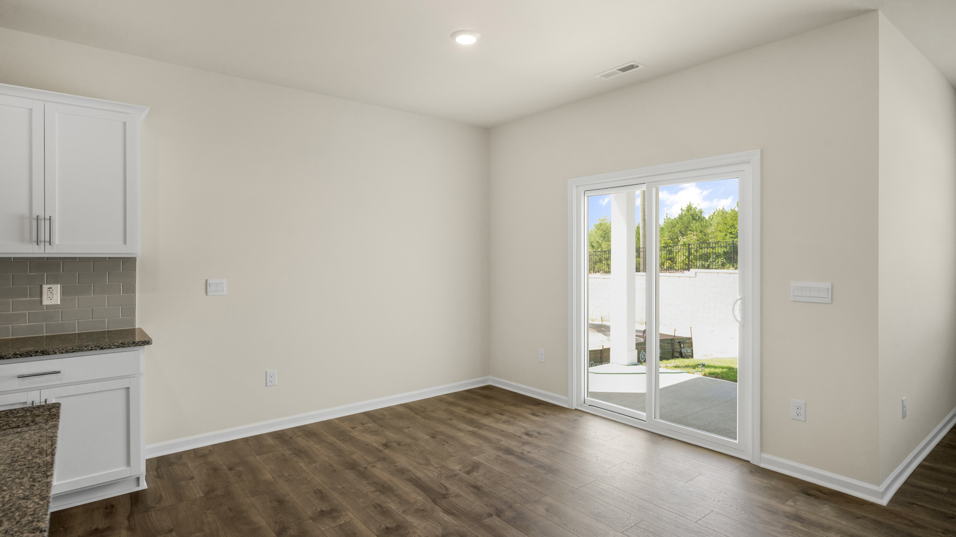 open concept dining space with sliding glass door to patio