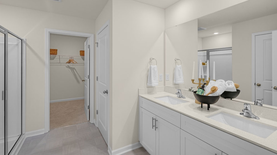 bathroom with quartz countertops and sub shower combo