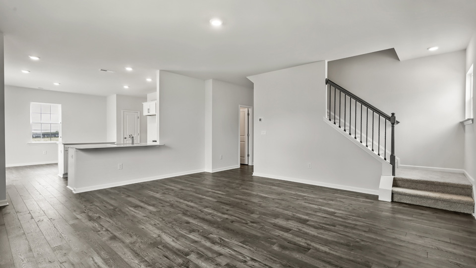 open concept living space with large windows