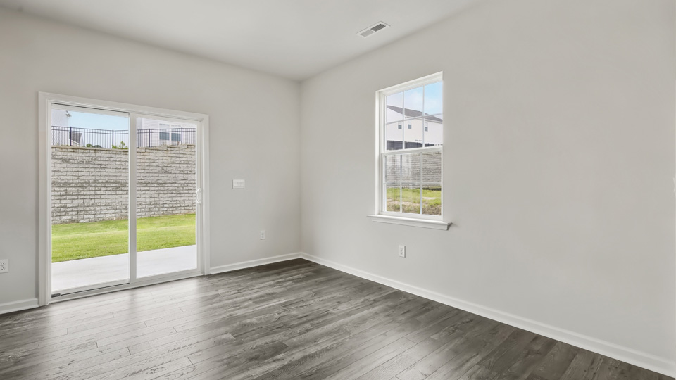 open concept dining space with sliding glass door to patio