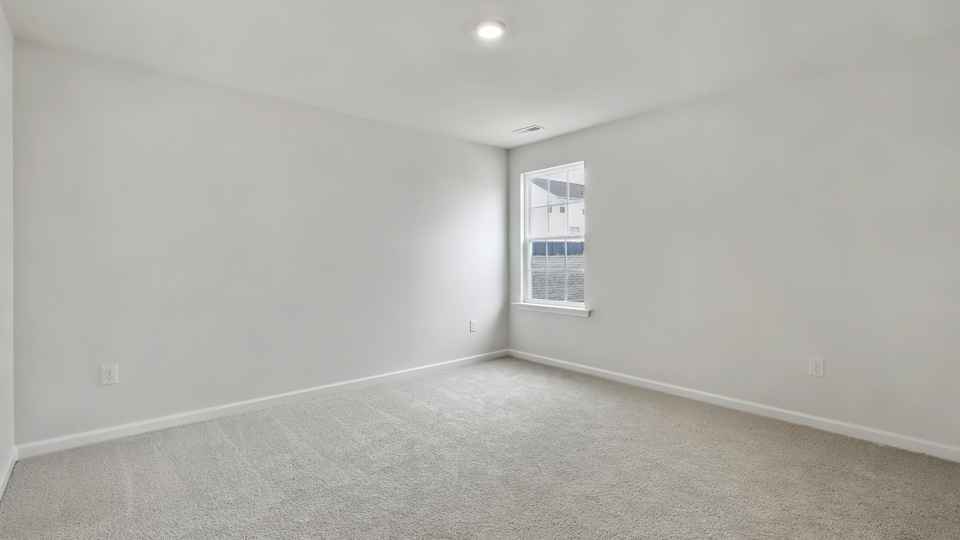 additional bedroom with window, carpeting, closet