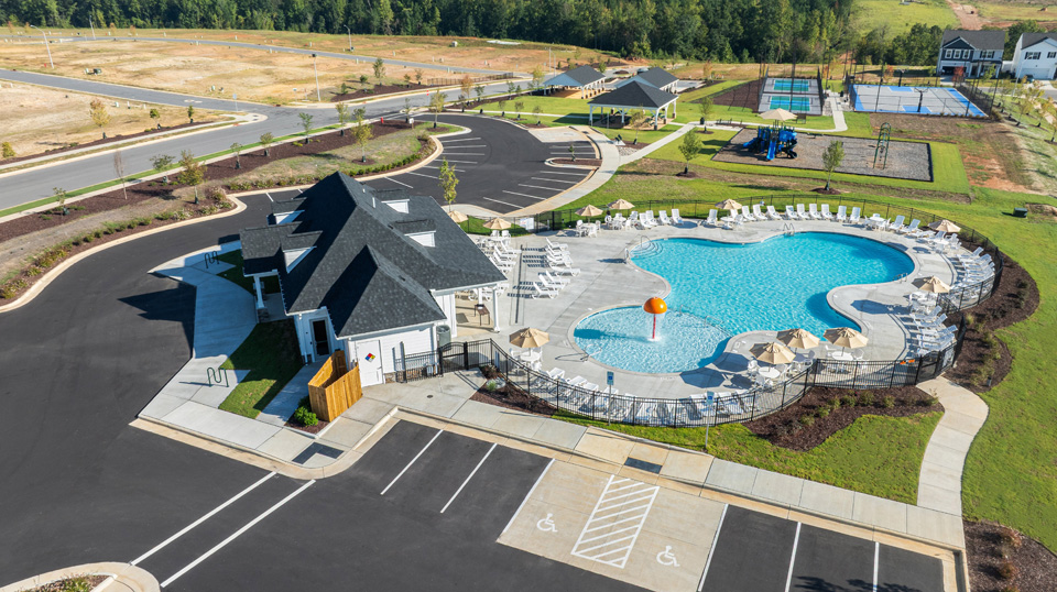 aerial shot of community pool clubhouse and playground