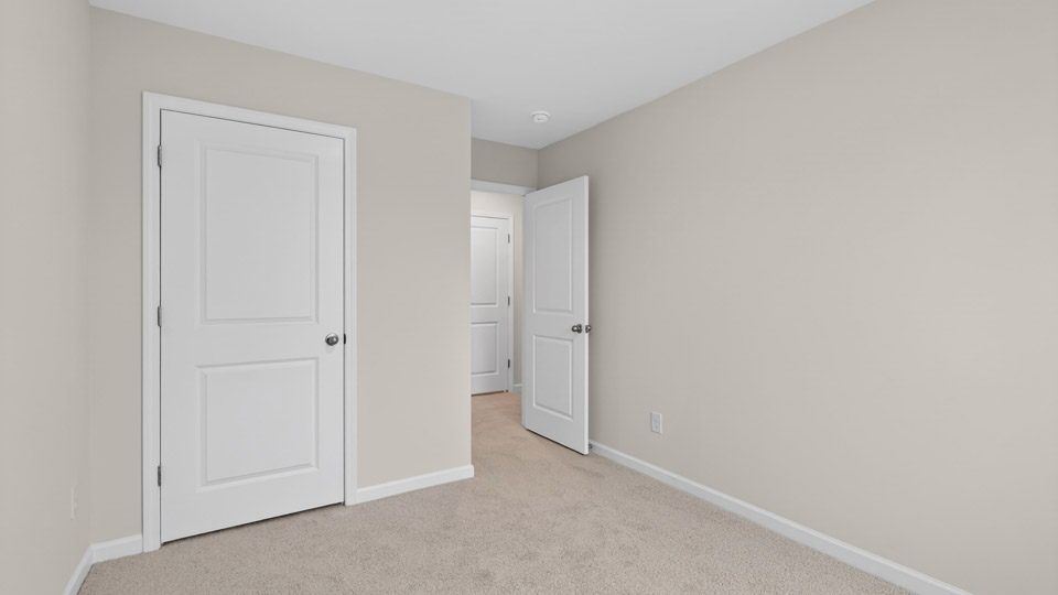 Bedroom with carpet floor and closet