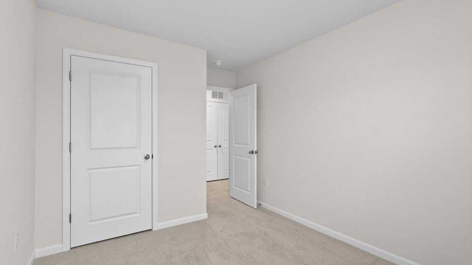 Bedroom with carpet floor and closet