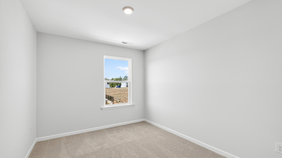 additional bedroom with window, carpeting, closet