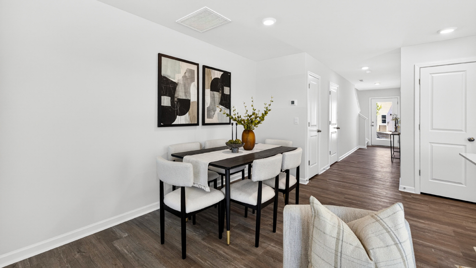 open concept dining space with door to patio