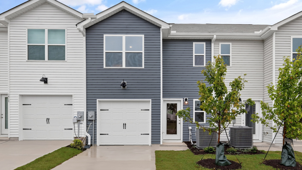 back exterior with rear load garage