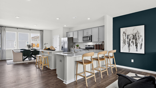 kitchen overlooking living room with quartz countertops and breakfast bar