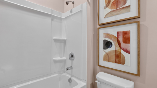 secondary bathroom with shower tub combo and single vanity sink