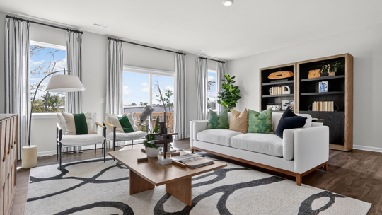 living room with natural lighting and revwood flooring