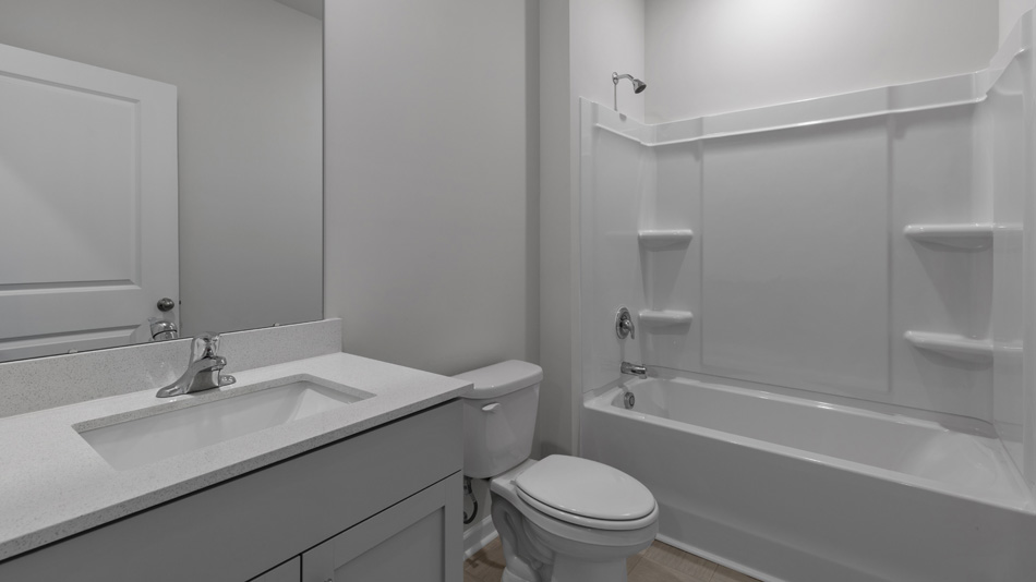 Bathroom with grey cabinets