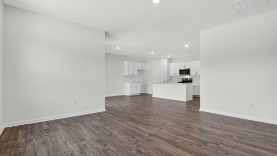 open concept living areas with revwood flooring