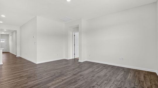 open concept living room with revwood flooring