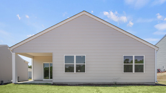 back of home with covered patio