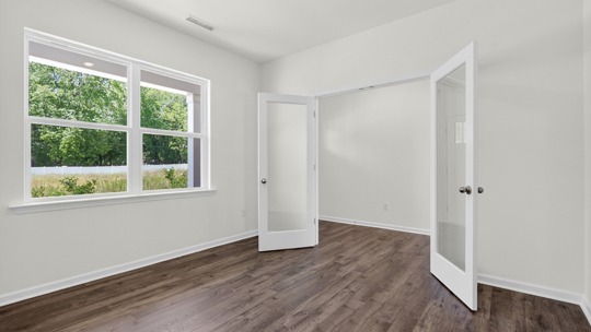 study with french doors and revwood flooring